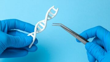 DNA helix research. Concept of genetic experiments on human biological code DNA. Scientist holding DNA helix and tweezers