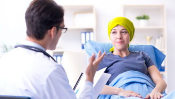 Cancer patient visiting doctor for medical consultation in clinic