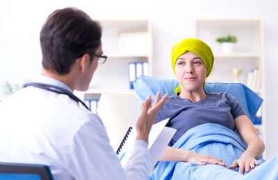 Cancer patient visiting doctor for medical consultation in clinic